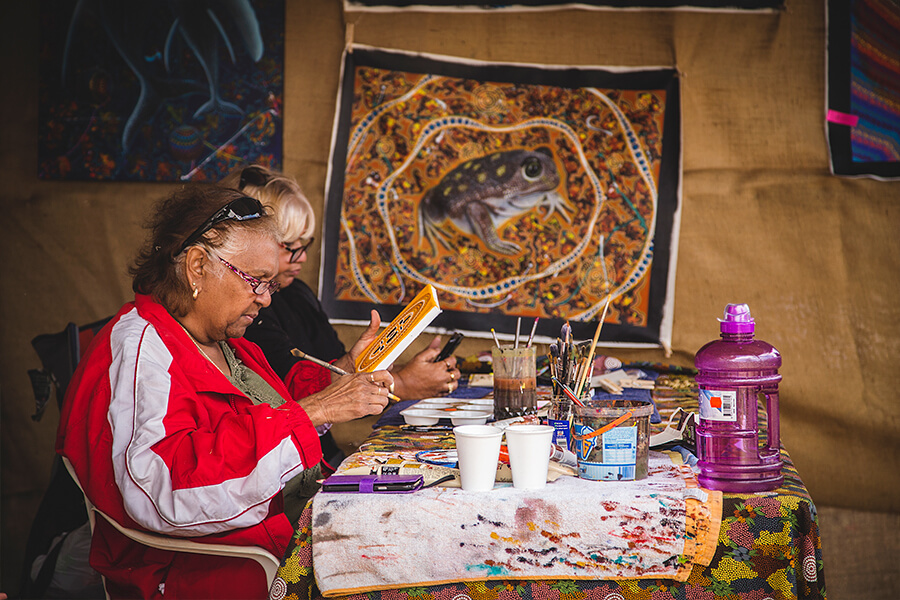 Admire the Aboriginal artists at work and purchase a painting